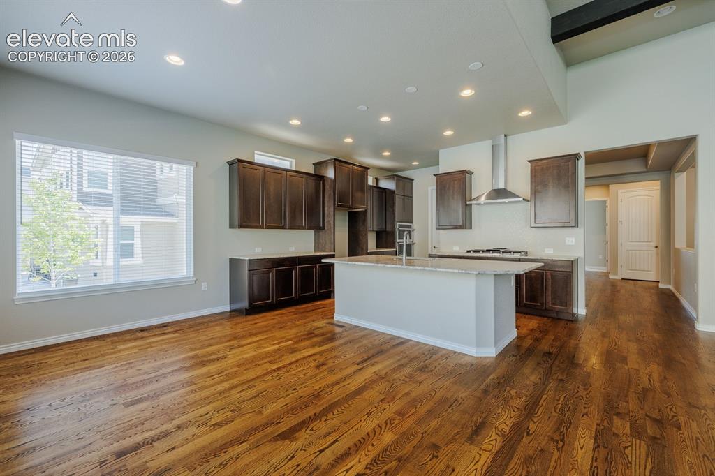 Image 11 of 47: kitchen faces the fun and entertaining back yard