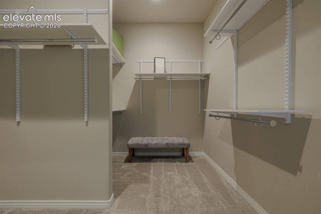 Image 26 of 47: Main bedroom LARGE wak in closet. Circles over to the main level laundry ro