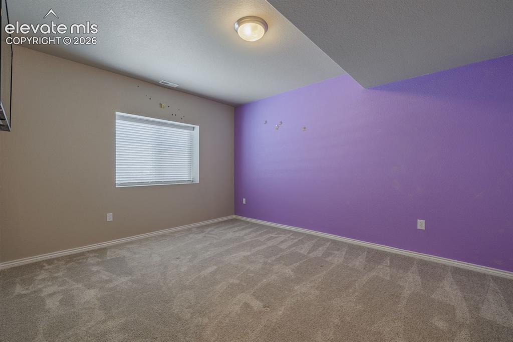 Image 35 of 47: 5th bedroom with 3/4 bath in hall