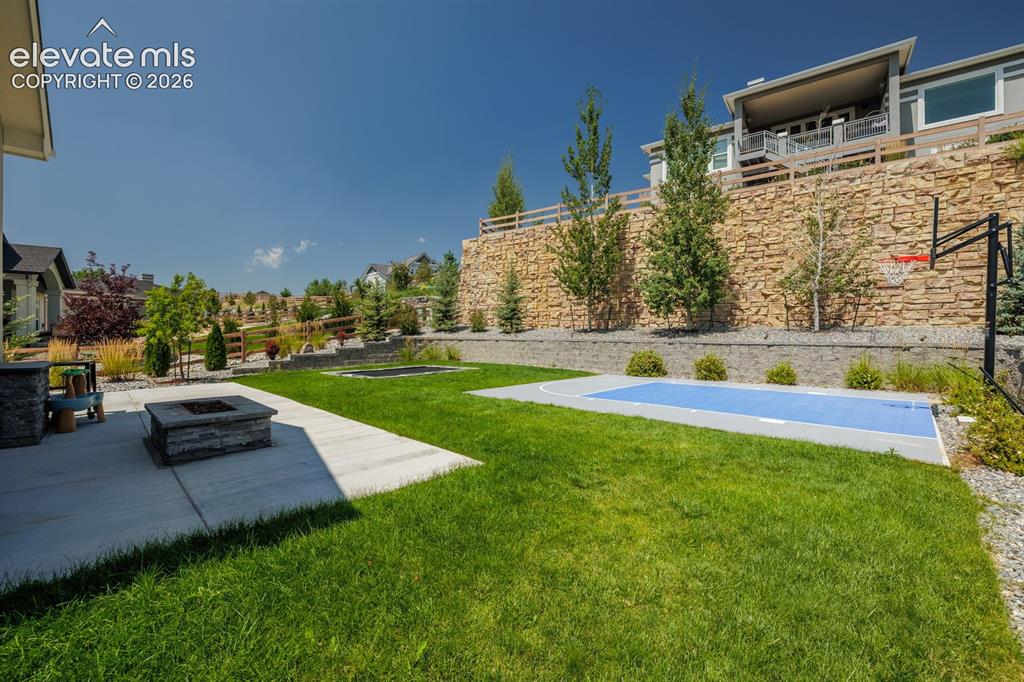 Image 40 of 47: amazing yard. Outdoor kitchen and tap