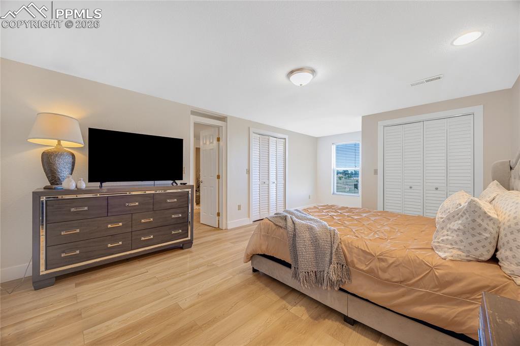 Image 29 of 42: This room features light-toned flooring, white walls, and a window providin