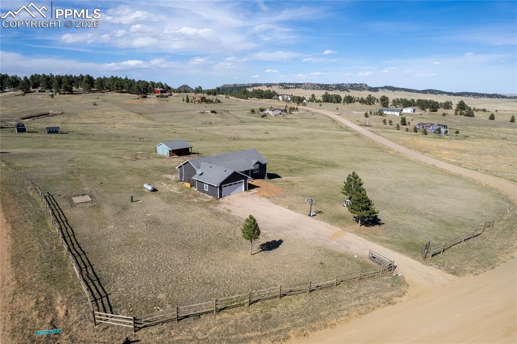 Image 3 of 42: This property features a single-story residence with an attached garage, a 