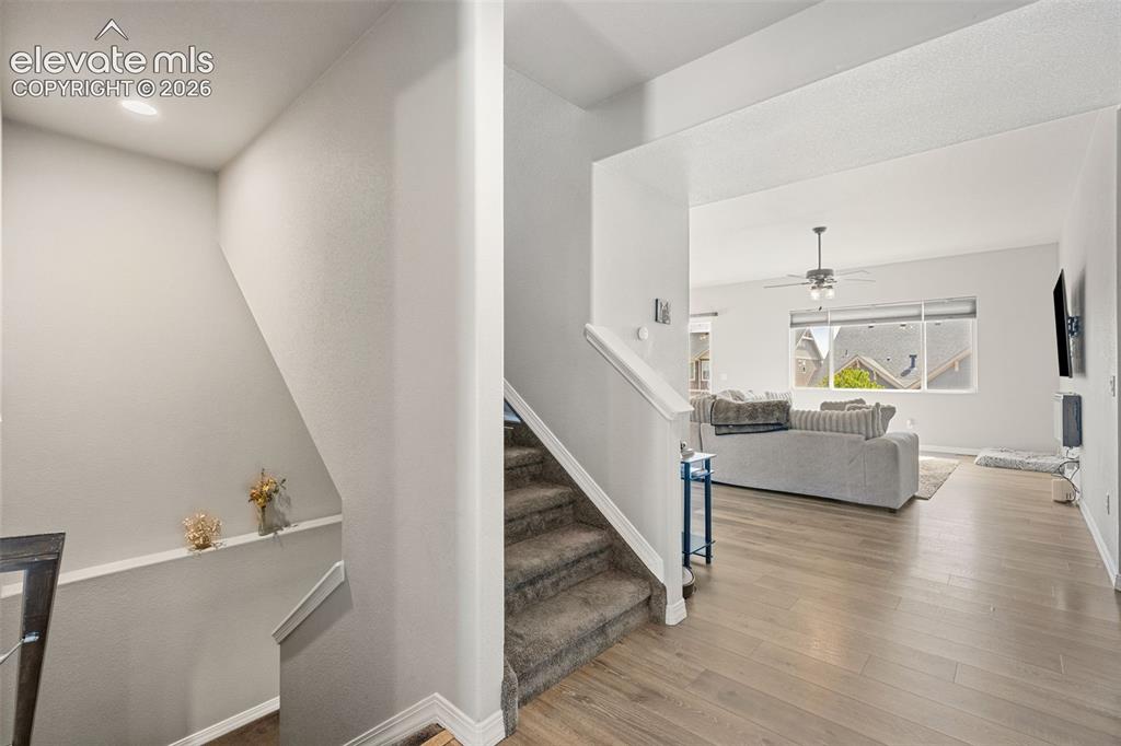 Image 11 of 44: The entryway features wood-finish flooring extending into the main living s