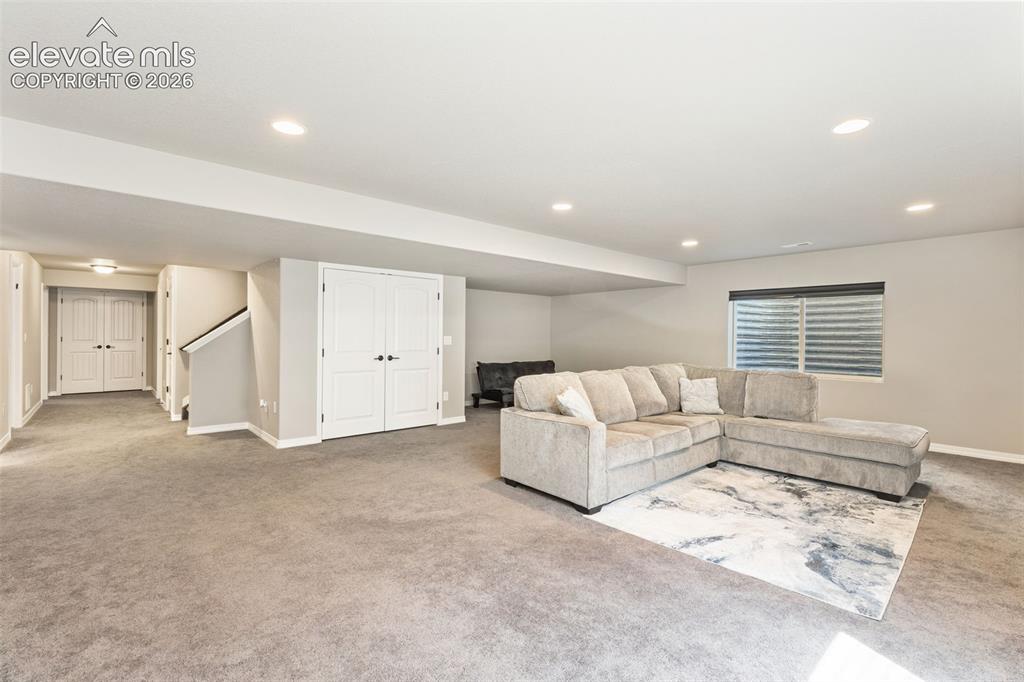 Image 35 of 44: Spacious lower level featuring plush carpeting, recessed lighting, double p
