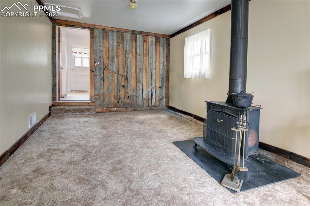 Image 17 of 20: FAMILY ROOM OR BEDROOM WITH FIREPLACE