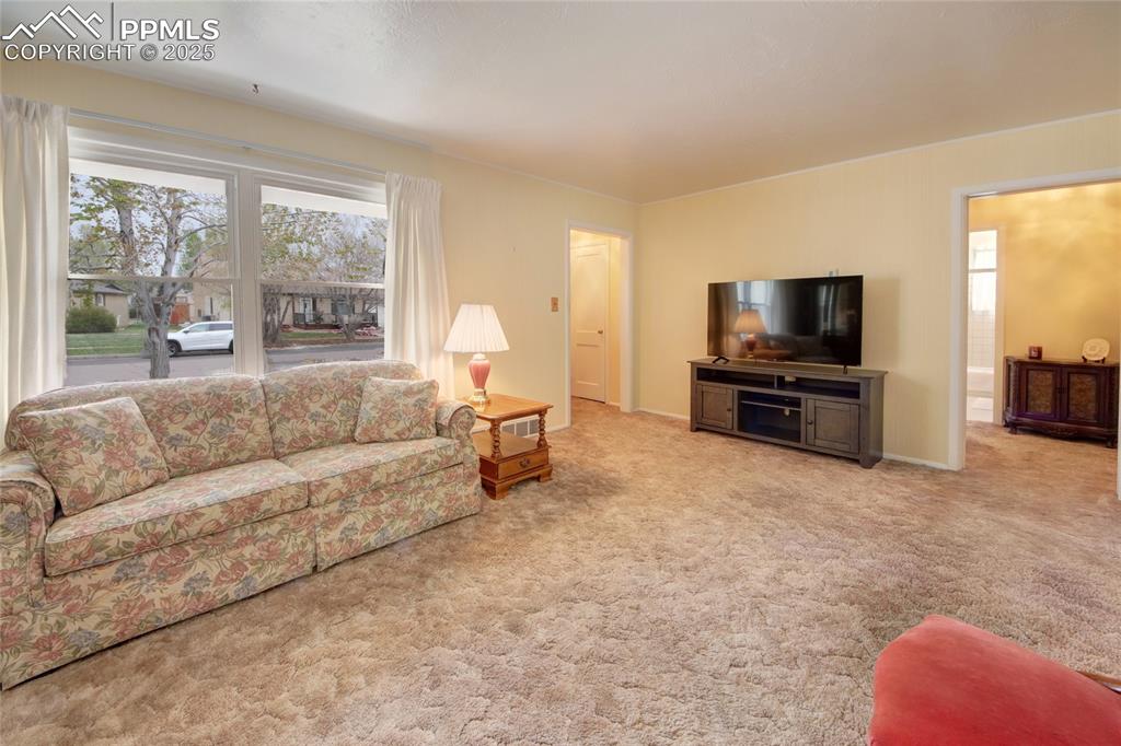 Image 3 of 20: LIVING ROOM WITH PICTURE WINDOW AND FIREPLACE