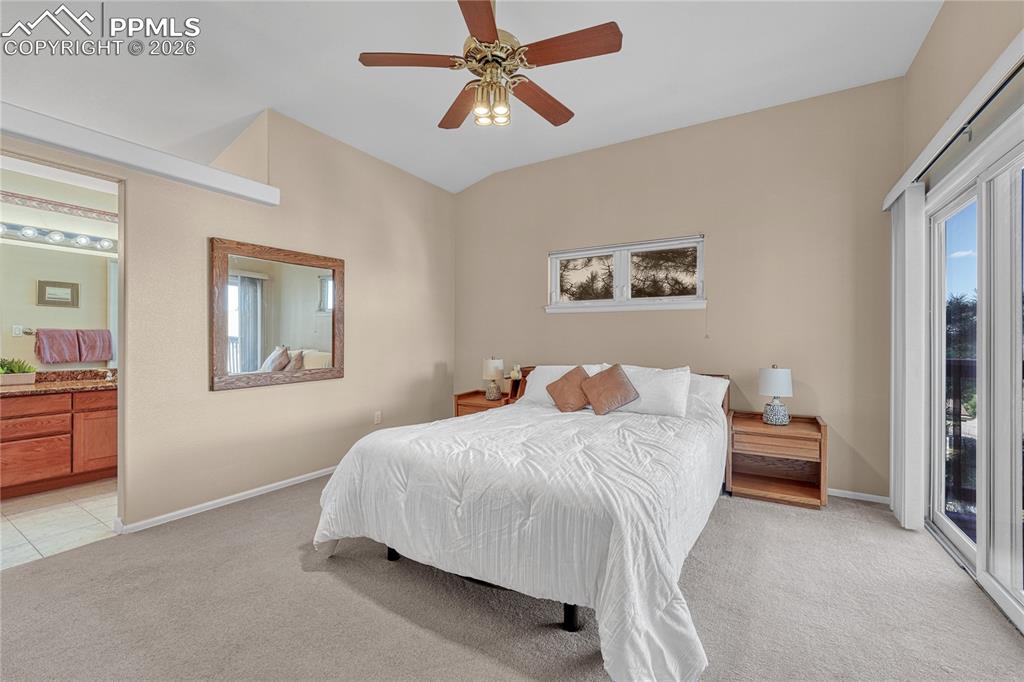Image 17 of 50: Primary bedroom offers vaulted ceiling, walk-in closet, adjoining 5-piece b