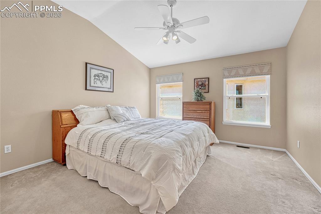 Image 23 of 50: First of two large additional main level bedrooms...