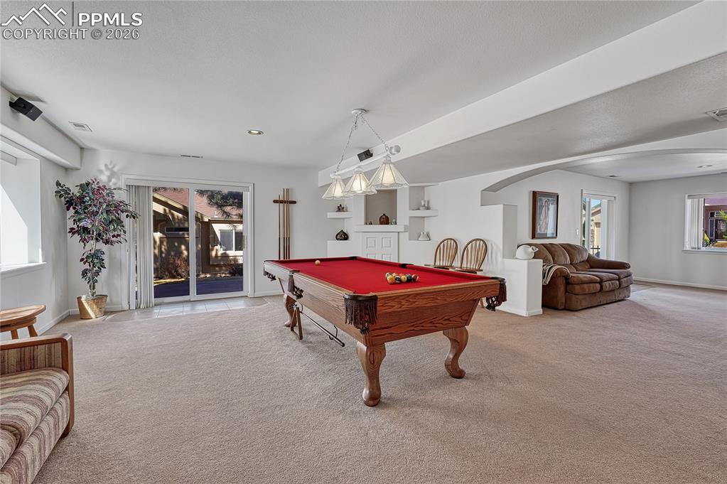 Image 36 of 50: ...and walk-out to a 2nd concrete patio and the backyard. 