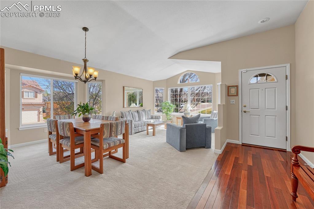 Image 4 of 50: Brazilian cherry floors upon entry and through to the kitchen.