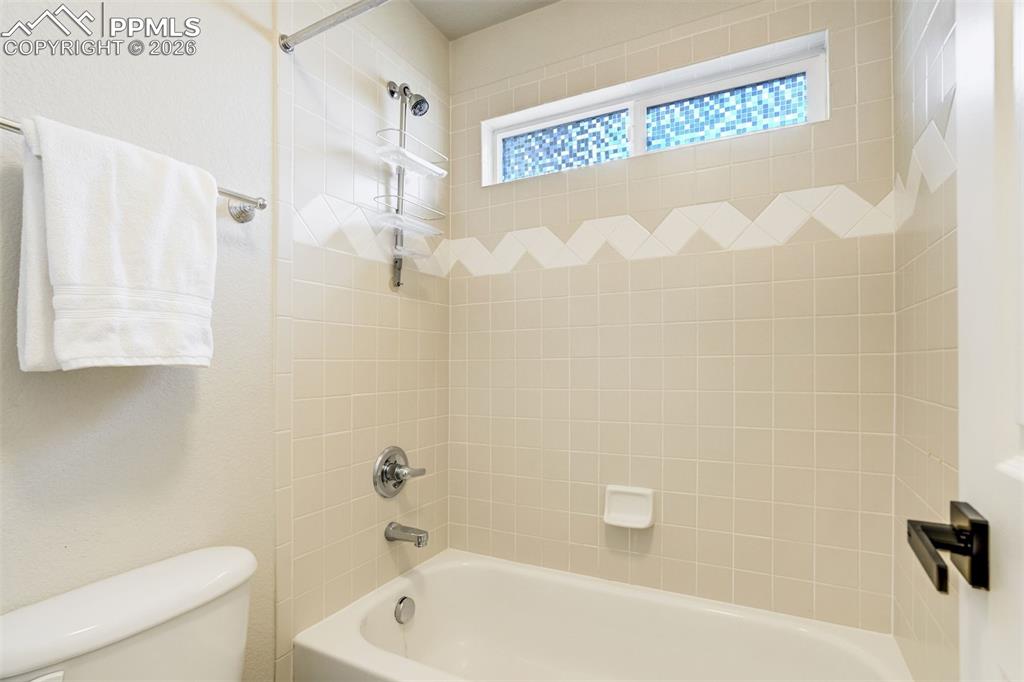 Image 32 of 45: Tub/ shower with a separate door.