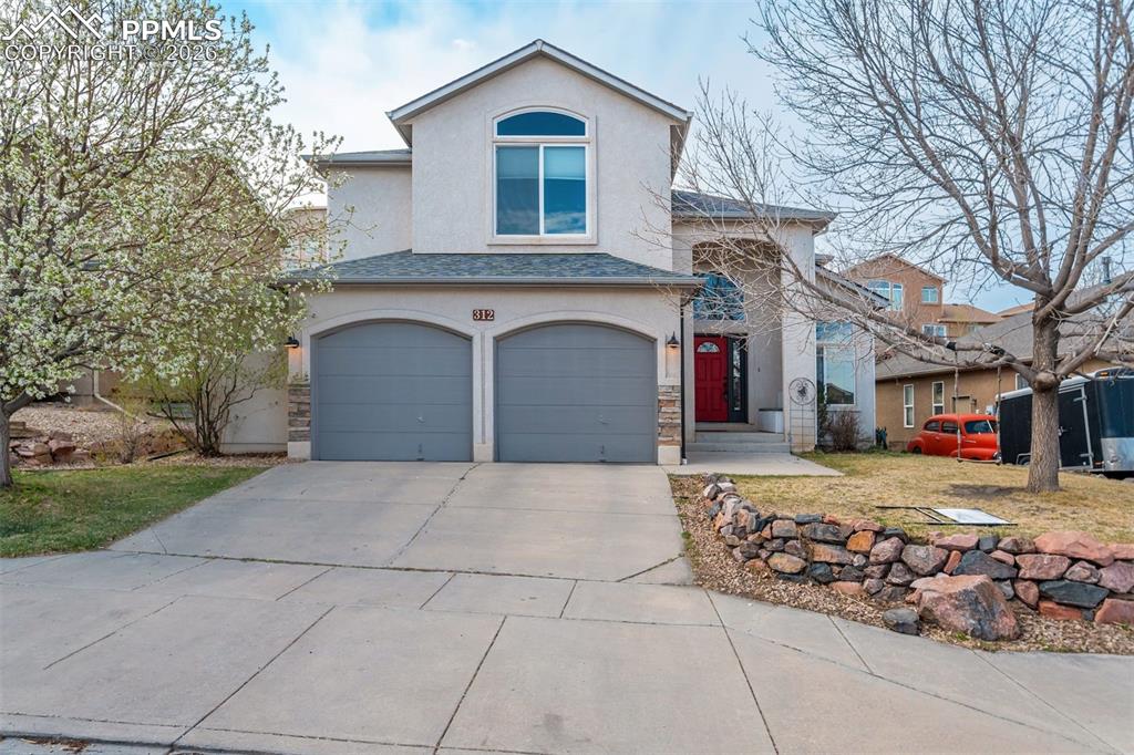 Image 44 of 45: Oversized garage with storage space.