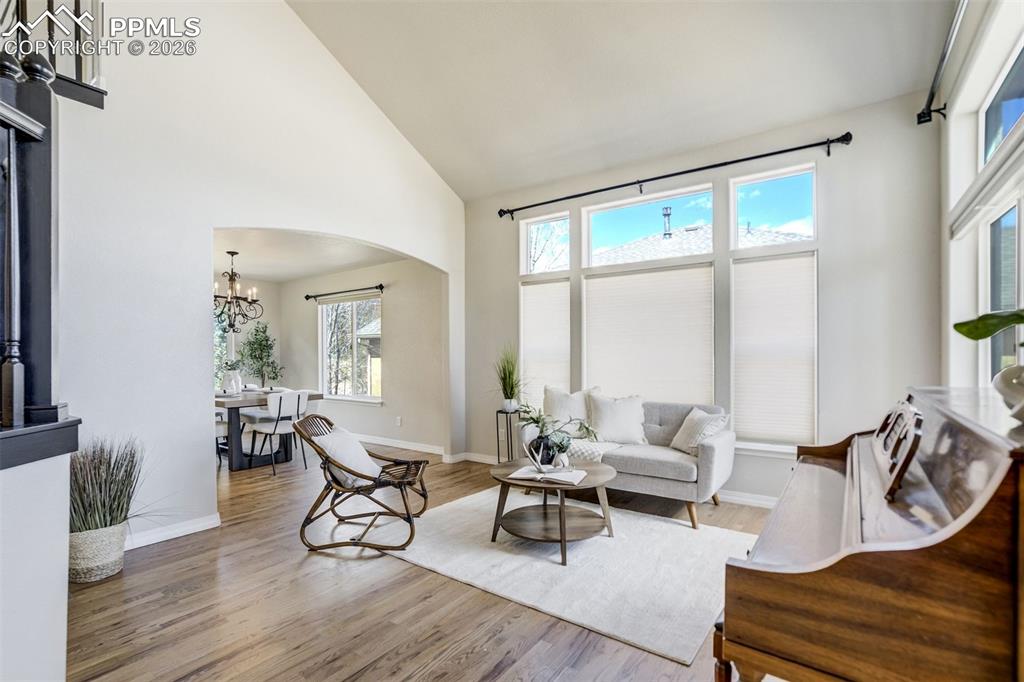 Image 5 of 45: New wood flooring throughout the main level.