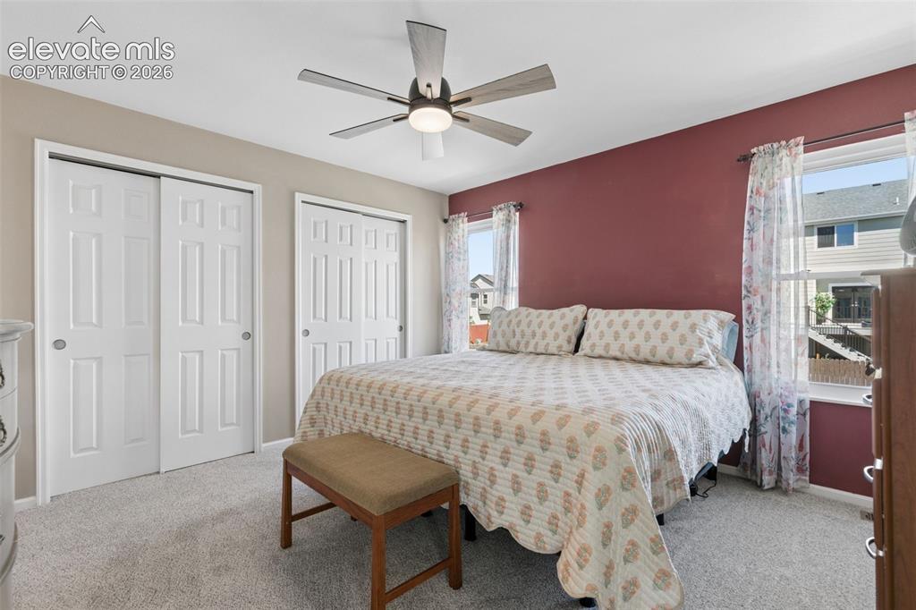 Image 24 of 35: Recessed lighting, ceiling fan with light fixture, two windows, two sliding