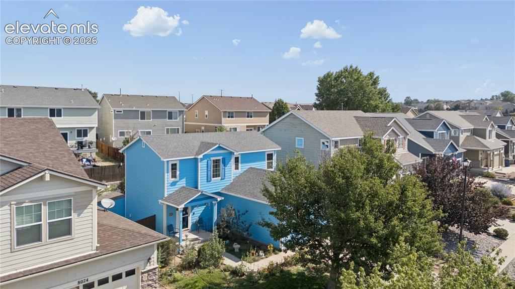 Image 30 of 35: Blue exterior siding with white trim and shutters