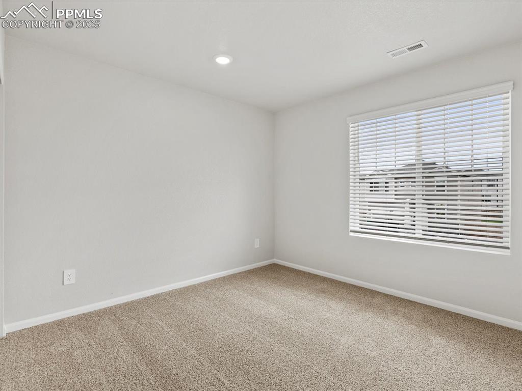 Image 18 of 22: Carpeted empty room with baseboards and recessed lighting
