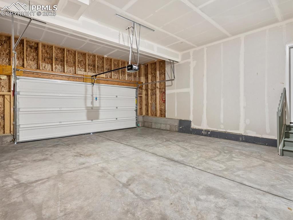 Image 19 of 22: Garage with a garage door opener