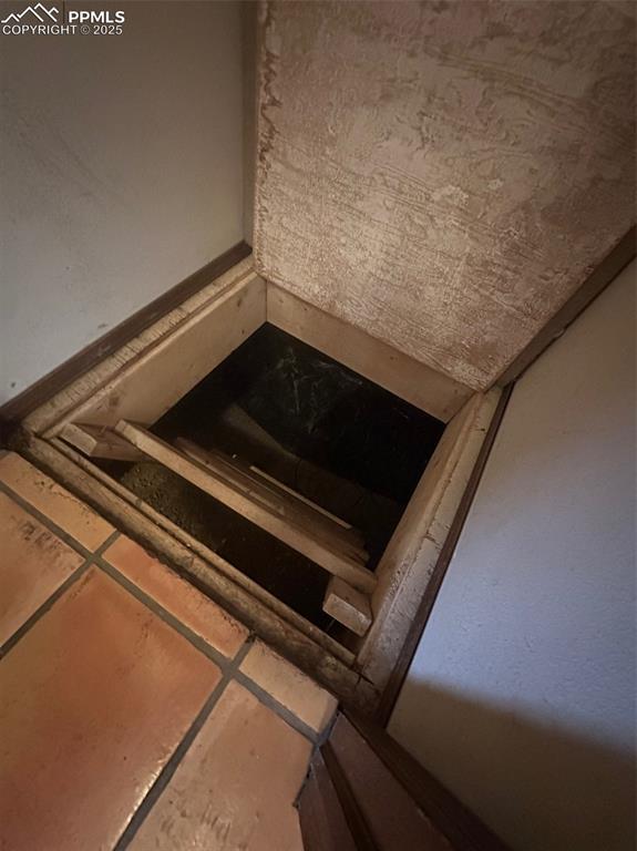 Image 13 of 22: Hall closet with crawl space access
