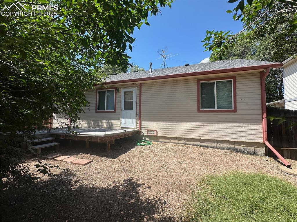 Image 17 of 22: Back of house with a deck