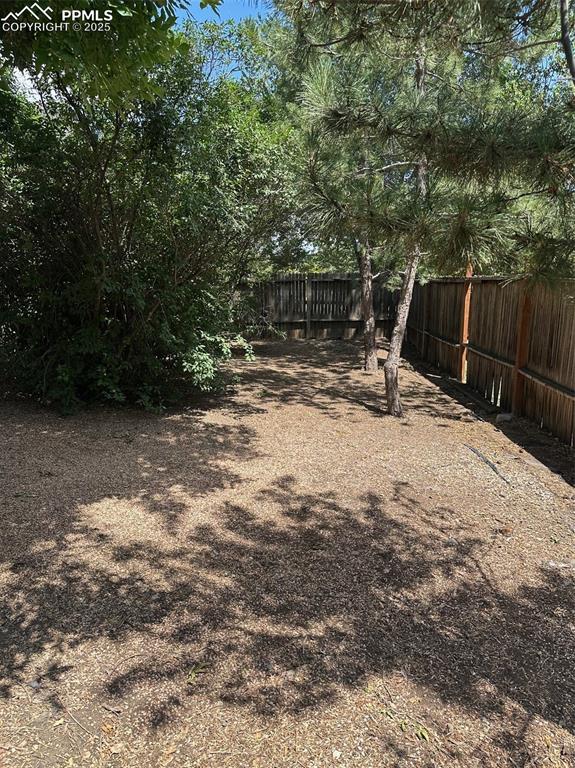 Image 18 of 22: View of fenced backyard