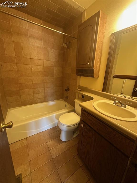 Image 9 of 22: Bathroom featuring tile patterned flooring, washtub / shower combination, a