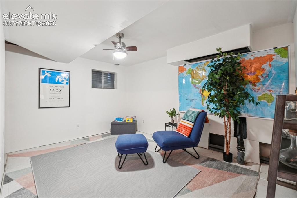 Image 17 of 24: Recessed ceiling with an exposed beam, a ceiling fan with integrated lighti