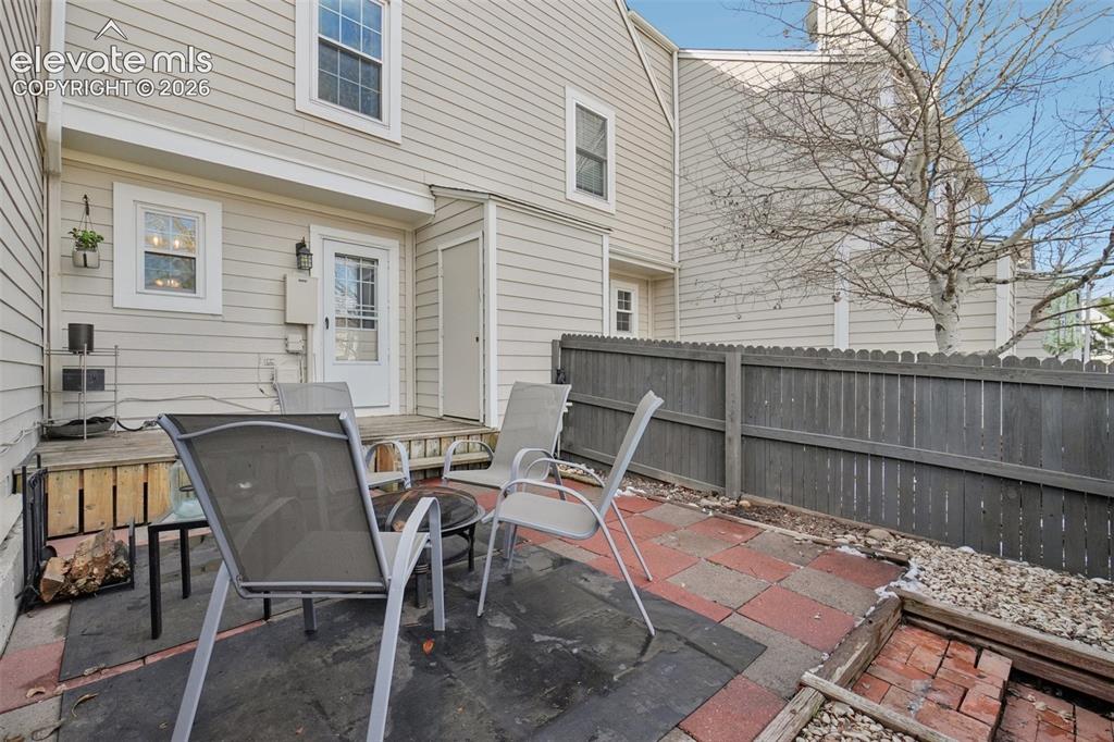 Image 21 of 24: Private outdoor patio featuring a combination of paver stones and concrete