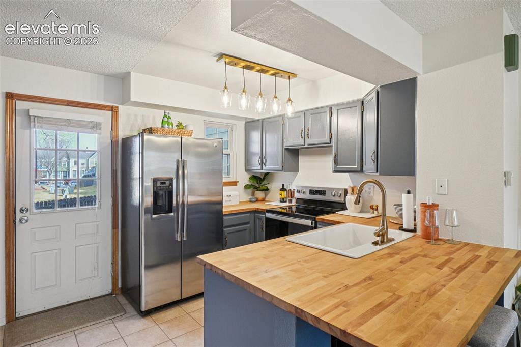 Image 9 of 24: updated kitchen with Brand new stove, dishwasher, refrigerator