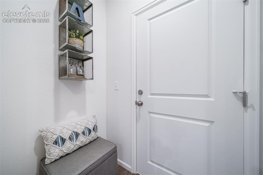 Image 10 of 41: White paneled door with brushed nickel hardware
*photos  of a model home*