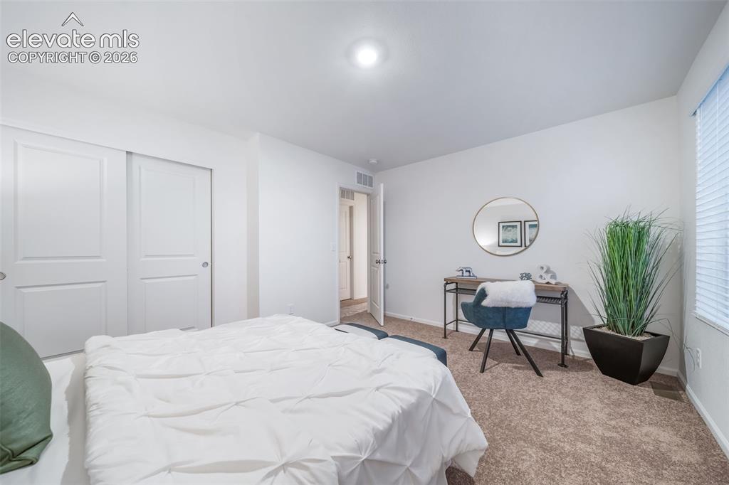 Image 2 of 41: Neutral tone wall paint, recessed lighting, carpet flooring, sliding closet