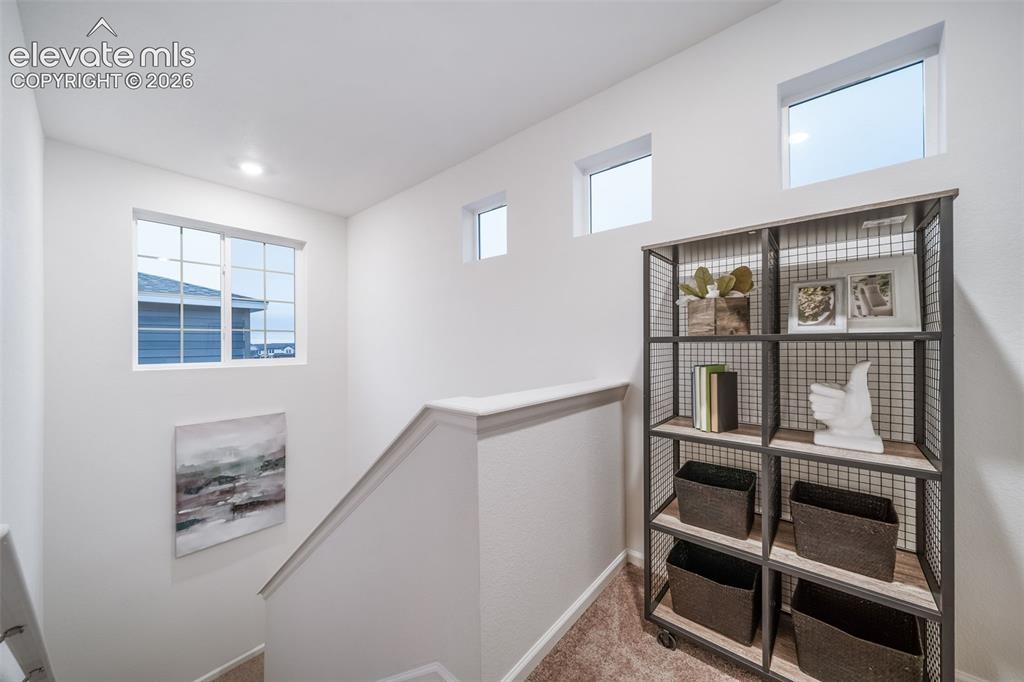 Image 27 of 41: Staircase with light wall paint and multiple windows
*photos of a model h