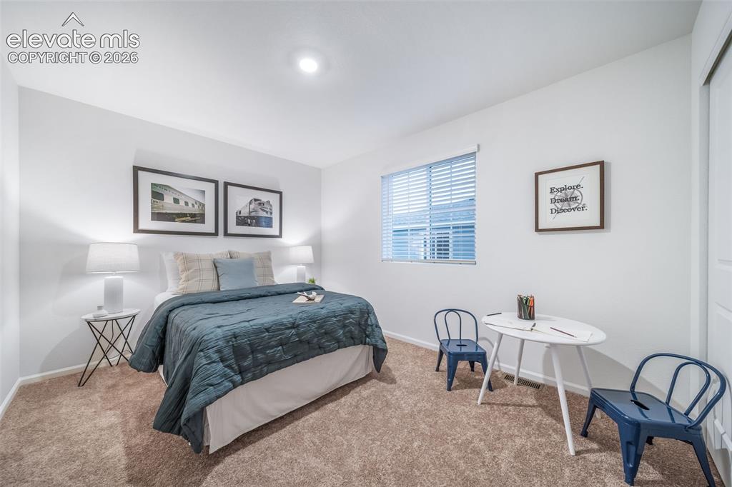 Image 5 of 41: Neutral wall paint, window with blinds, recessed lighting, and carpet floor
