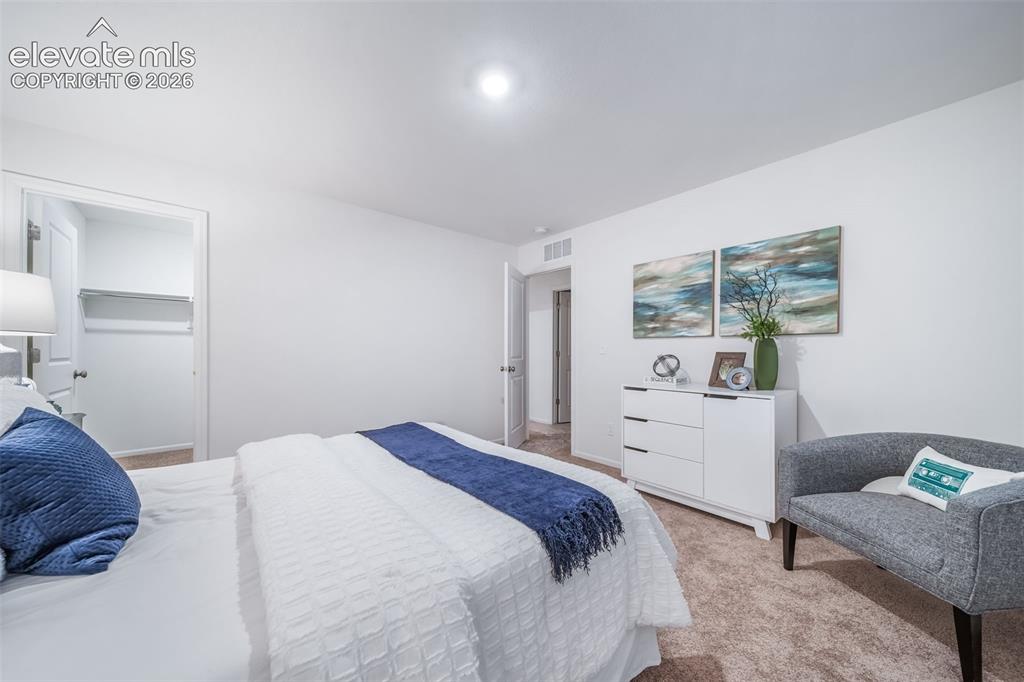 Image 6 of 41: Plush carpet flooring complements a neutral wall color
*photos of a model