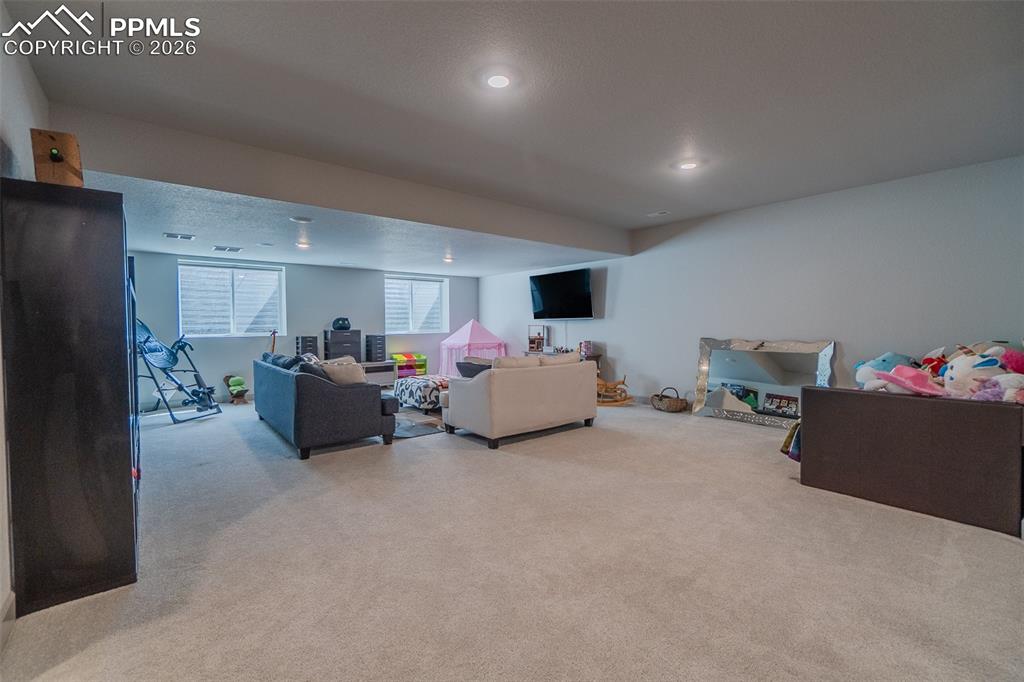 Image 35 of 49: Lower level recreation room featuring recessed lighting, light gray carpet 