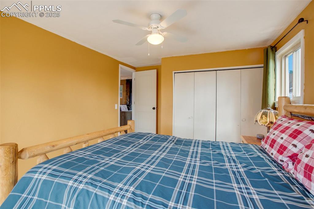 Image 24 of 36: Bedroom featuring ceiling fan and a closet
