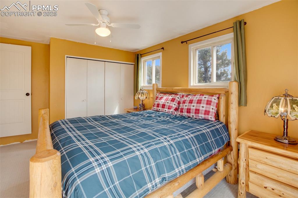 Image 25 of 36: Bedroom featuring carpet flooring, ceiling fan, and a closet
