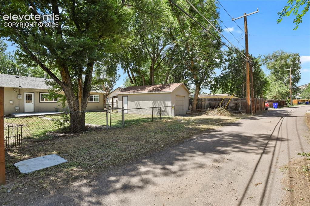 Image 28 of 28: Alley access in back of yard and garage