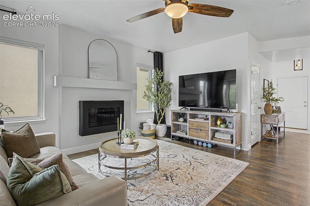 Image 15 of 35: Living room featuring a  gas fireplace with a mantelpiece, LPV finish floor