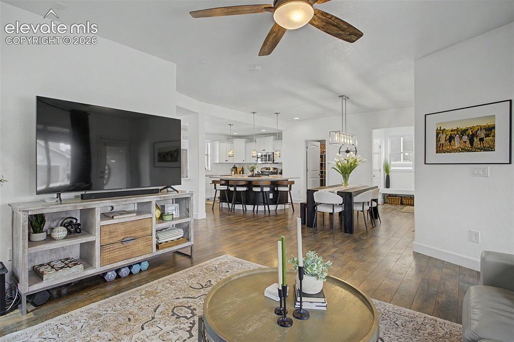 Image 16 of 35: Open-concept living space featuring LVP finish flooring, recessed lighting,