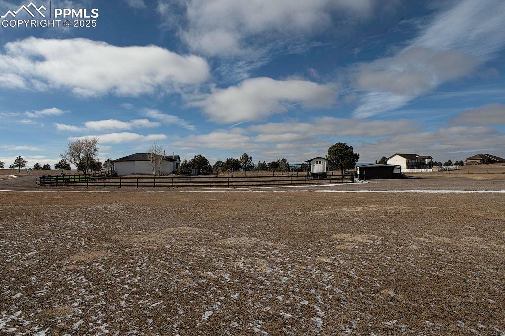 Image 21 of 23: Property side view of fenced backyard