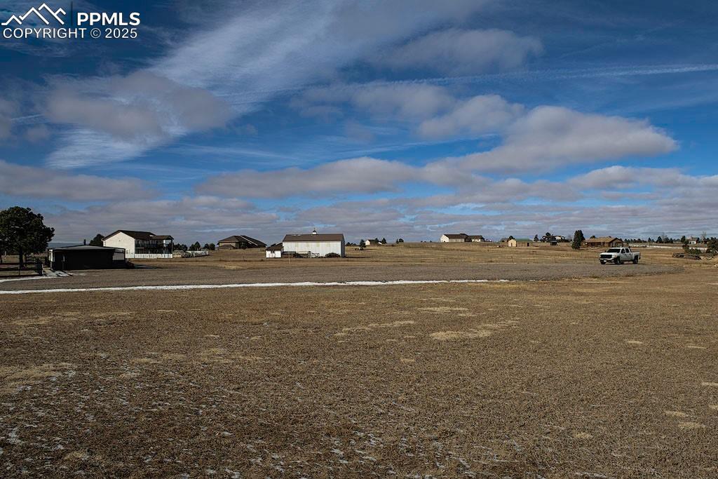Image 22 of 23: Back of property with detached garage