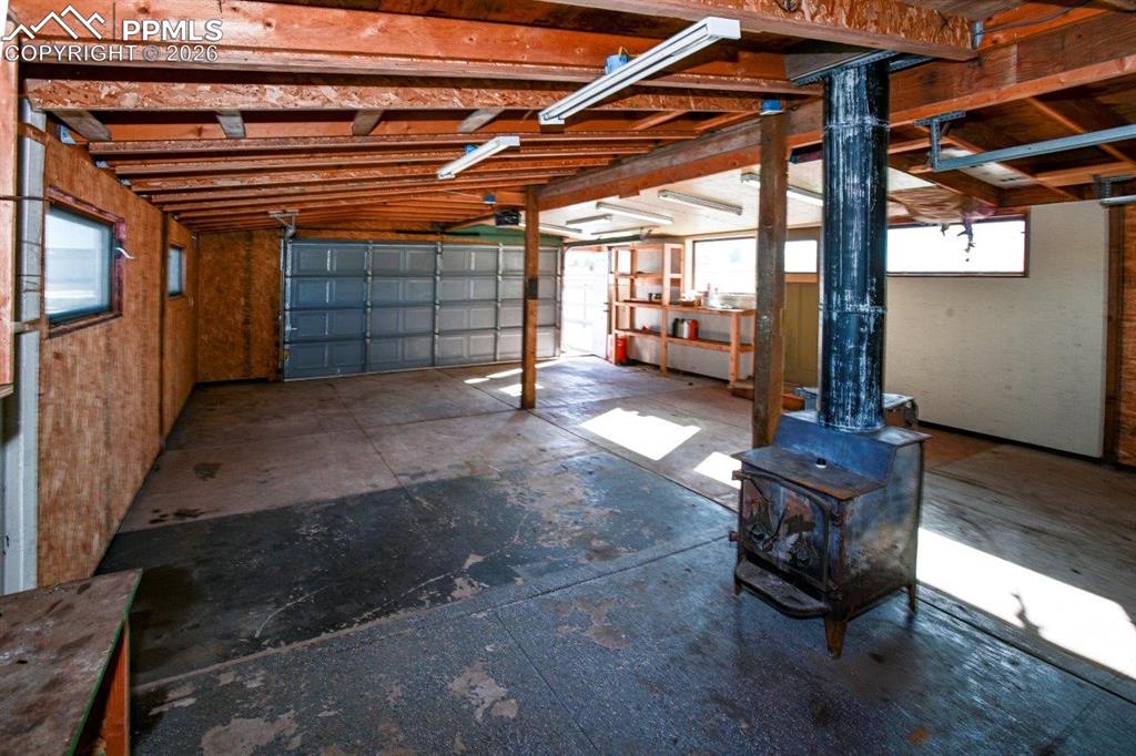 Image 26 of 29: Garage for Toys or You Custom Created Outdoor Entertaining Area