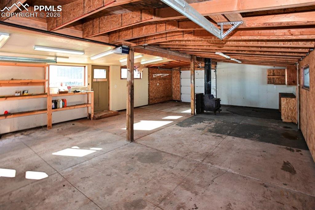 Image 27 of 29: Second View of Garage for Toys. Notice 2nd garage door. No backing in just