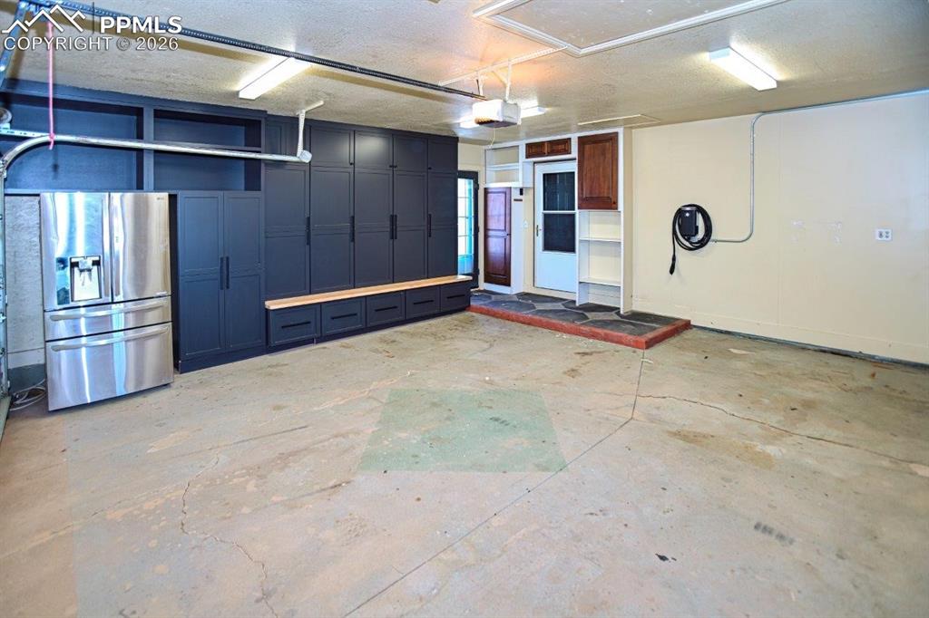 Image 29 of 29: Custom Locker Storage in Attached Garage.