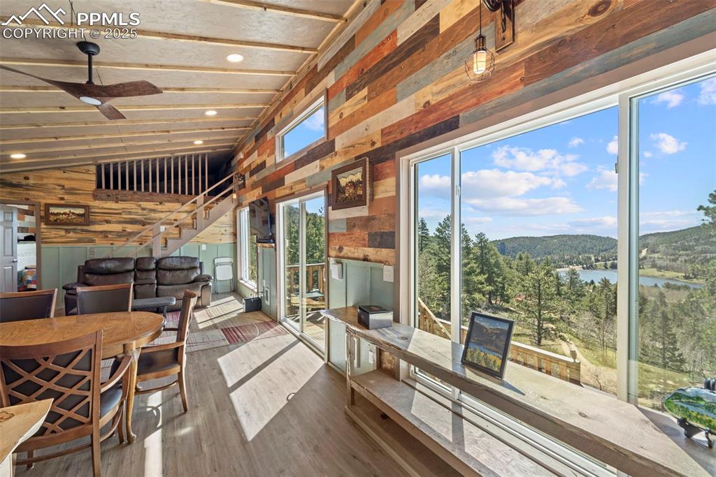 Image 20 of 35: Sunroom with a water view