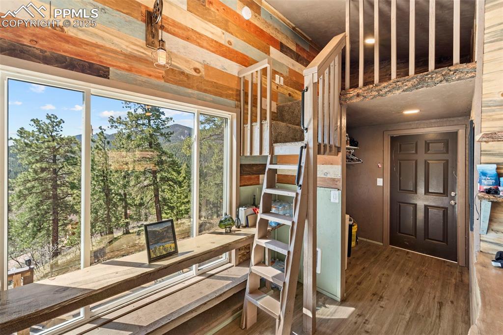 Image 32 of 35: Stairs to 1 of 2 Lofts at both ends of home 