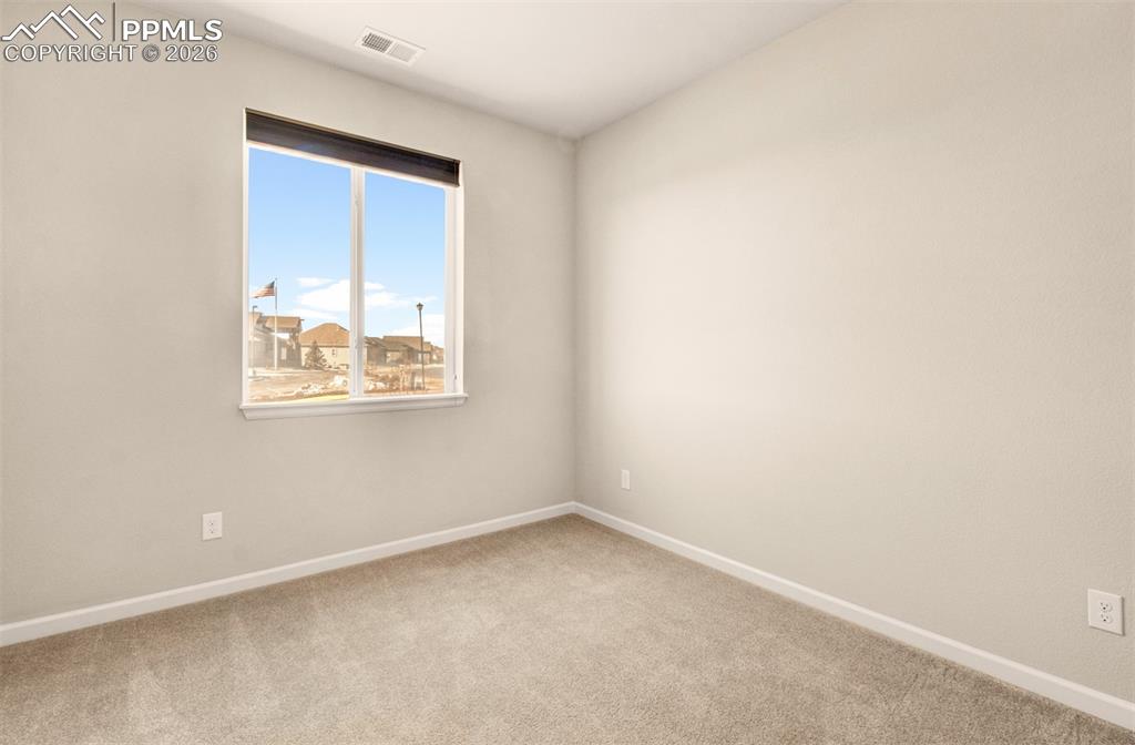 Image 17 of 29: Second bedroom