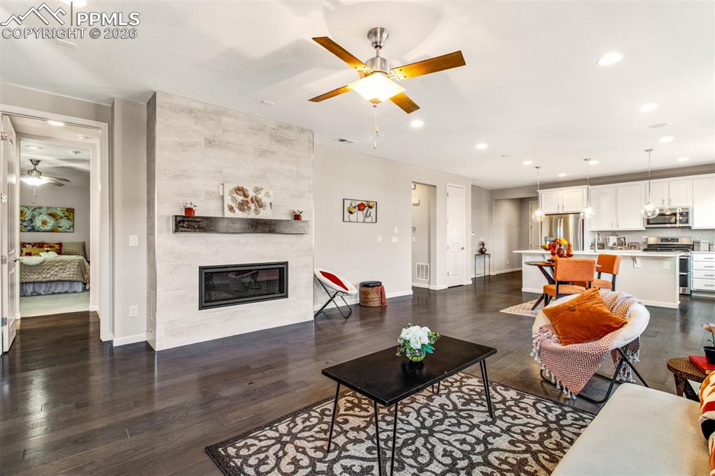 Image 5 of 29: Open main level with natural wood floors and loads of light