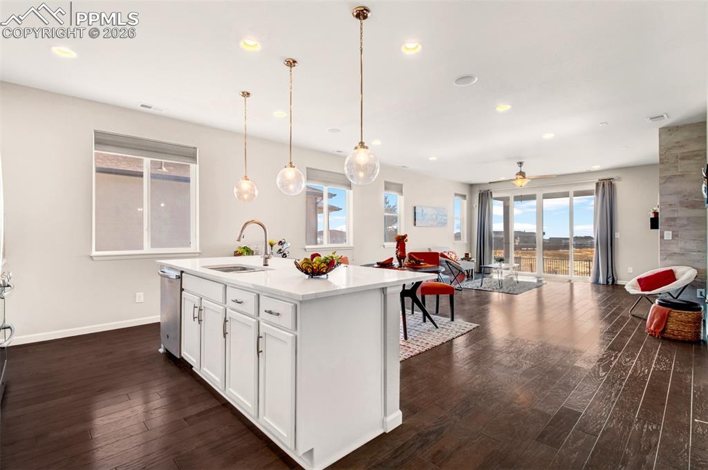 Image 6 of 29: Open layout with natural wood flooring