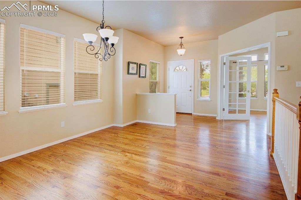 Image 3 of 42: Foyer & dining room